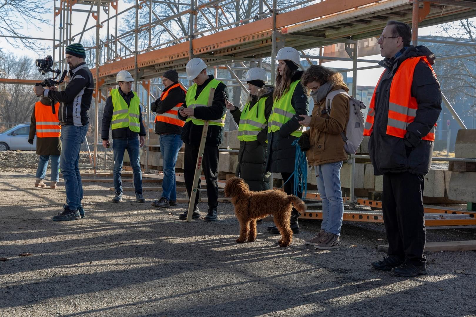 A part of our team on the construction site with puppy Fino